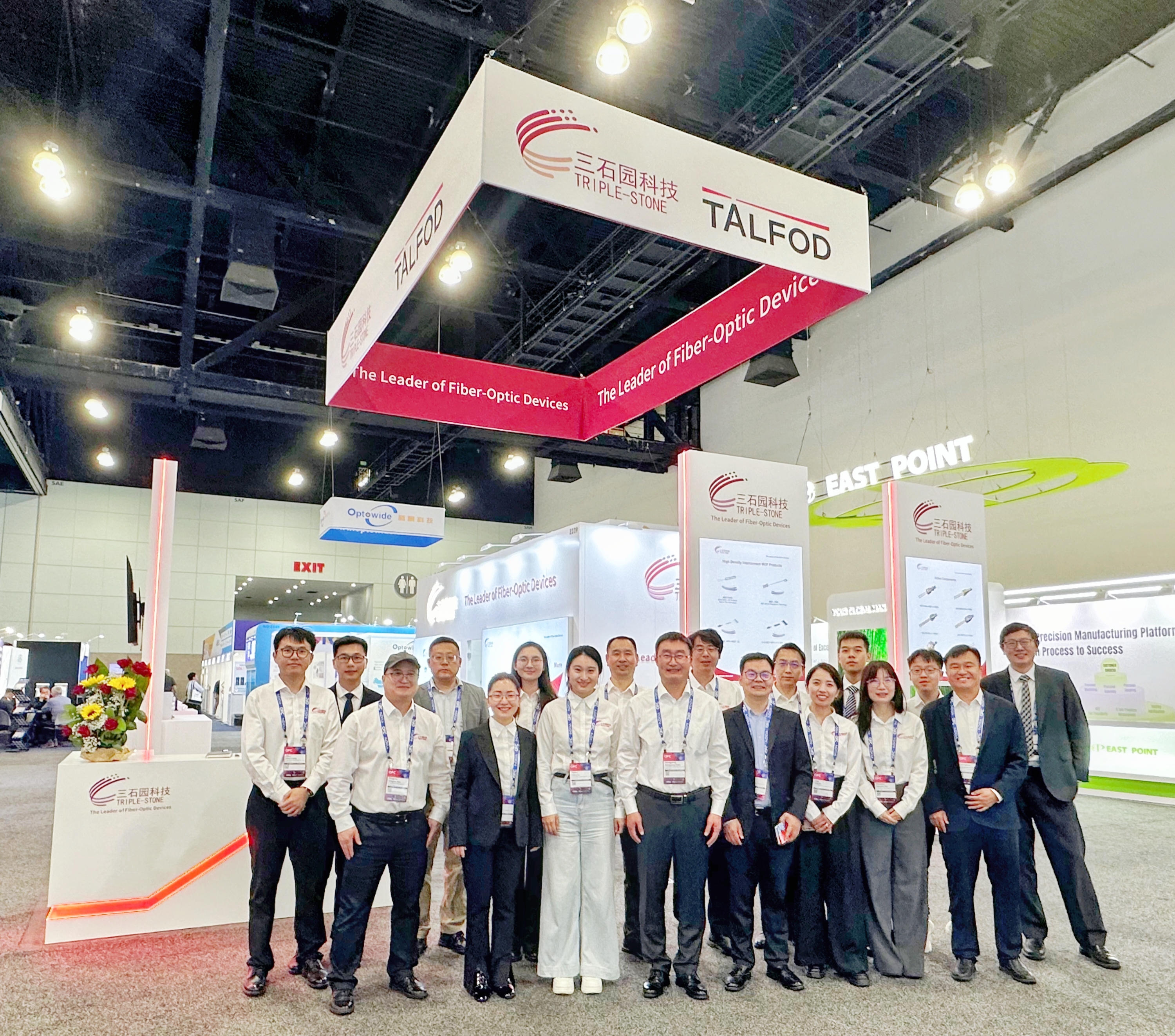 TALFOD exhibition booth group photo at OFC 2026